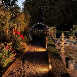 Country Charm Client Round Arch Lit Up at Night